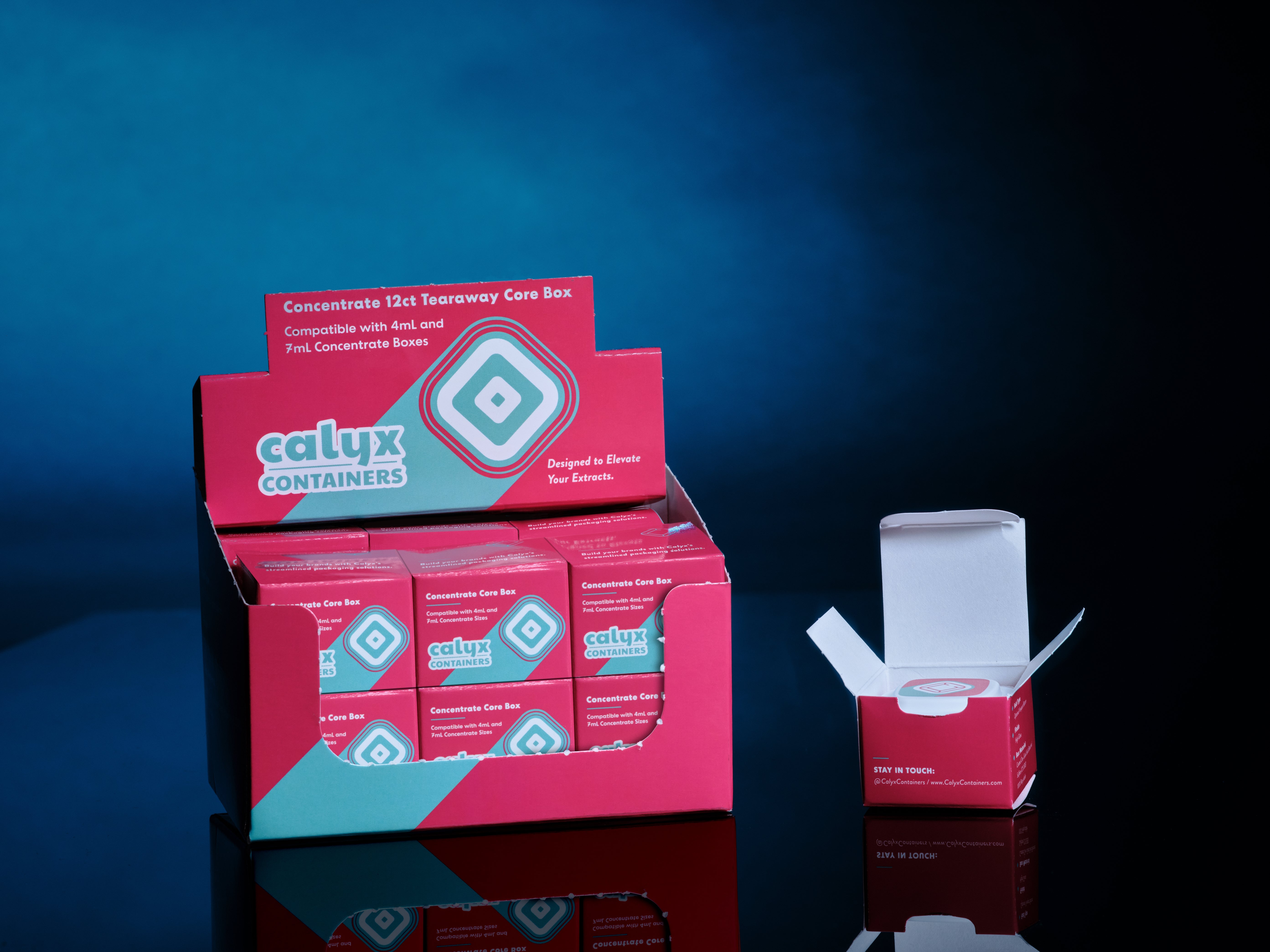 Display of Calyx containers, custom printed corrugated box display with a blue background