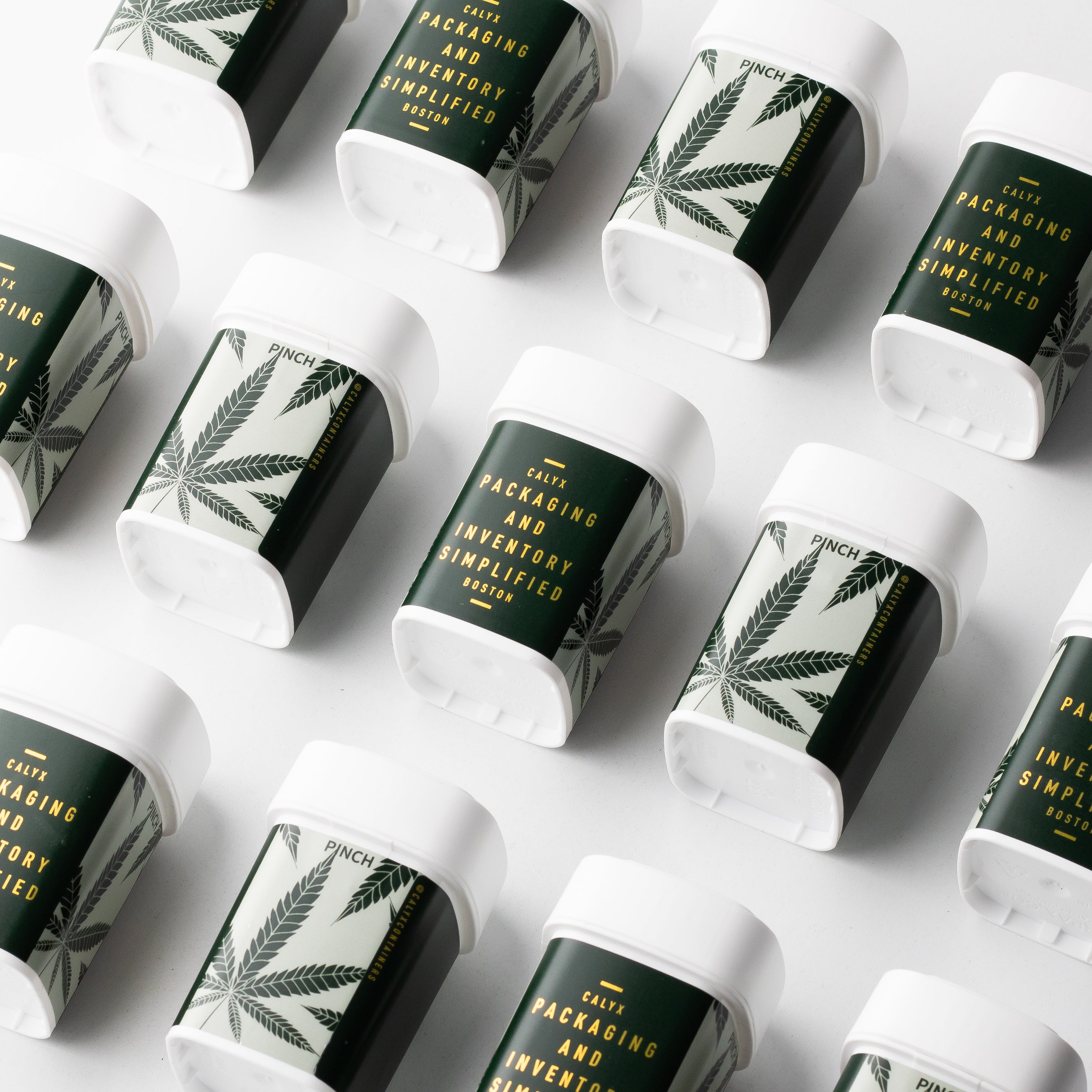 Multiple cannabis package containers with a cannabis leaf design on a white background
