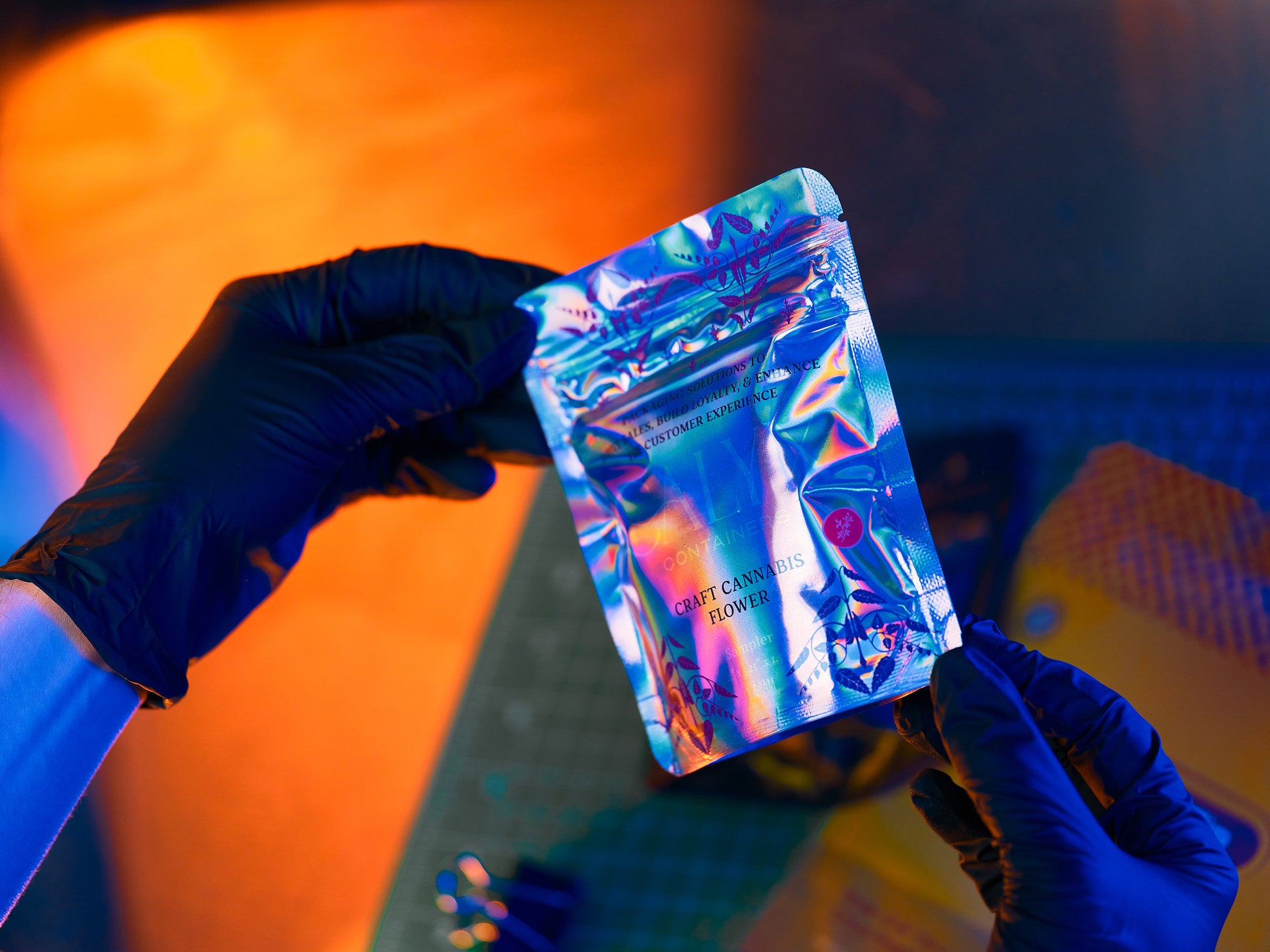 Person holding custom designed flexible cannabis packaging