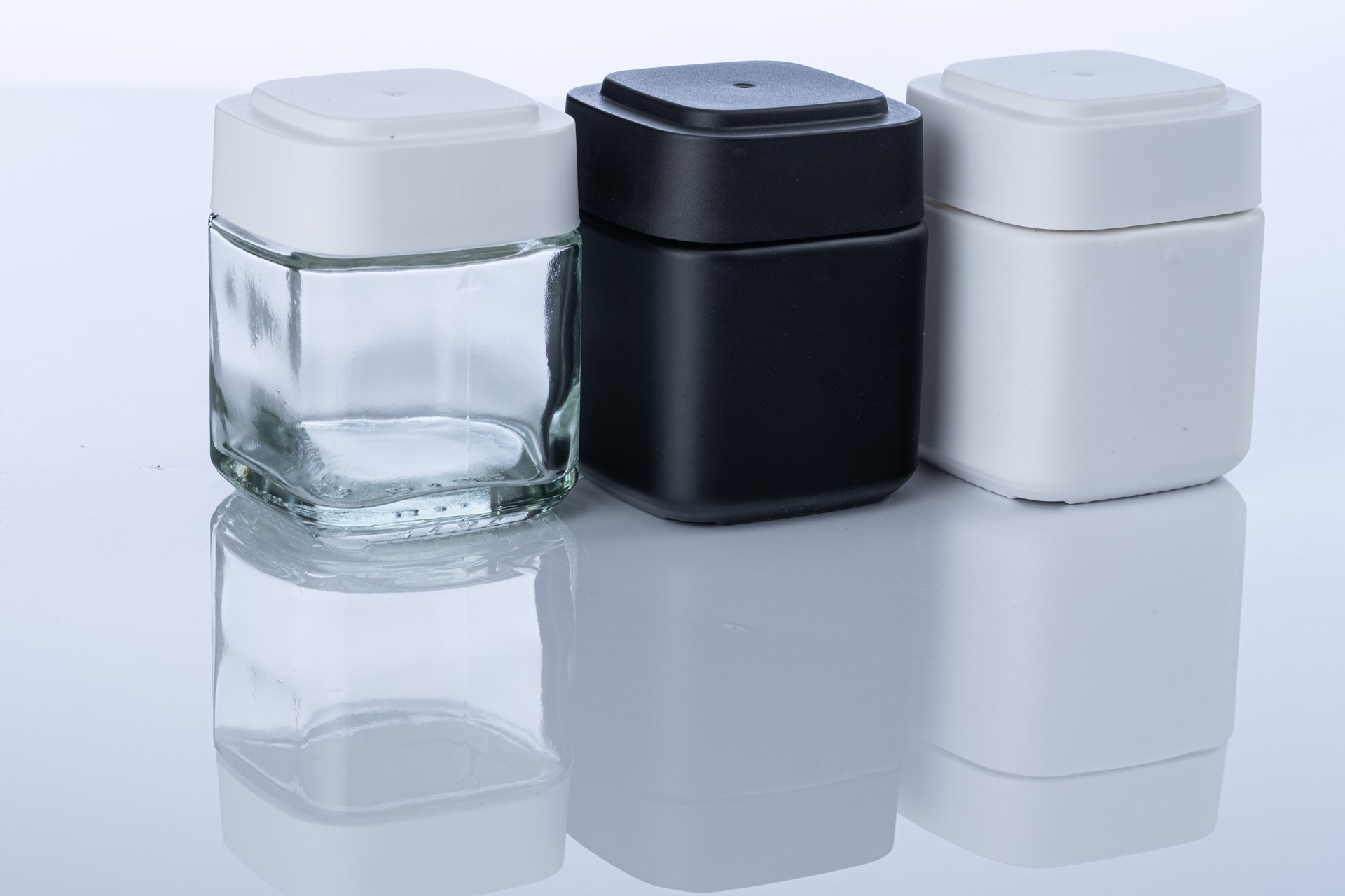  Calyx cannabis containers in black, white, and glass.