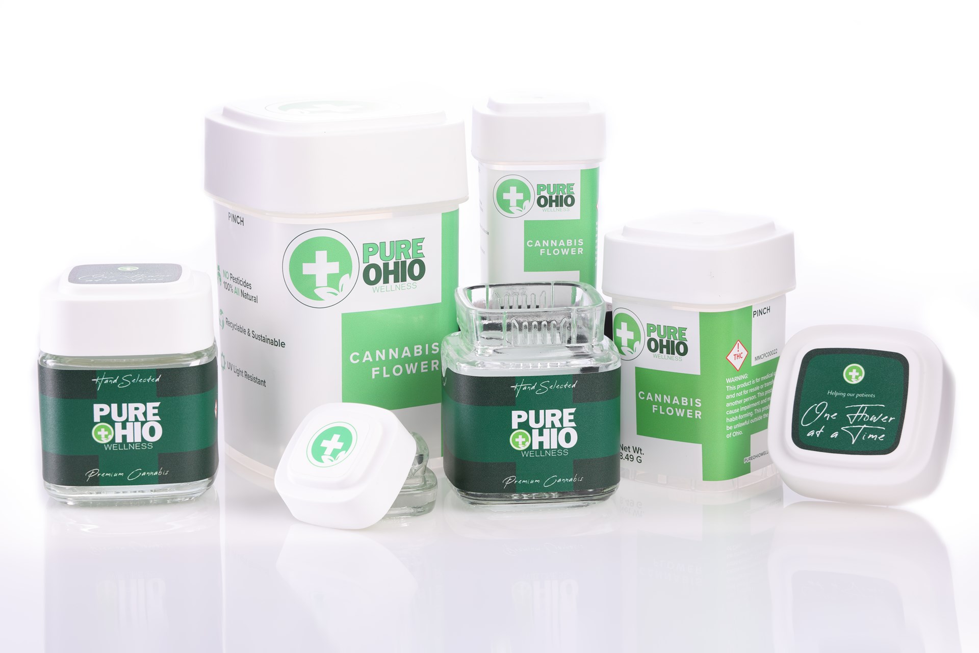 Calyx jars, drams, and concentrate containers with custom Pure Ohio Wellness branding