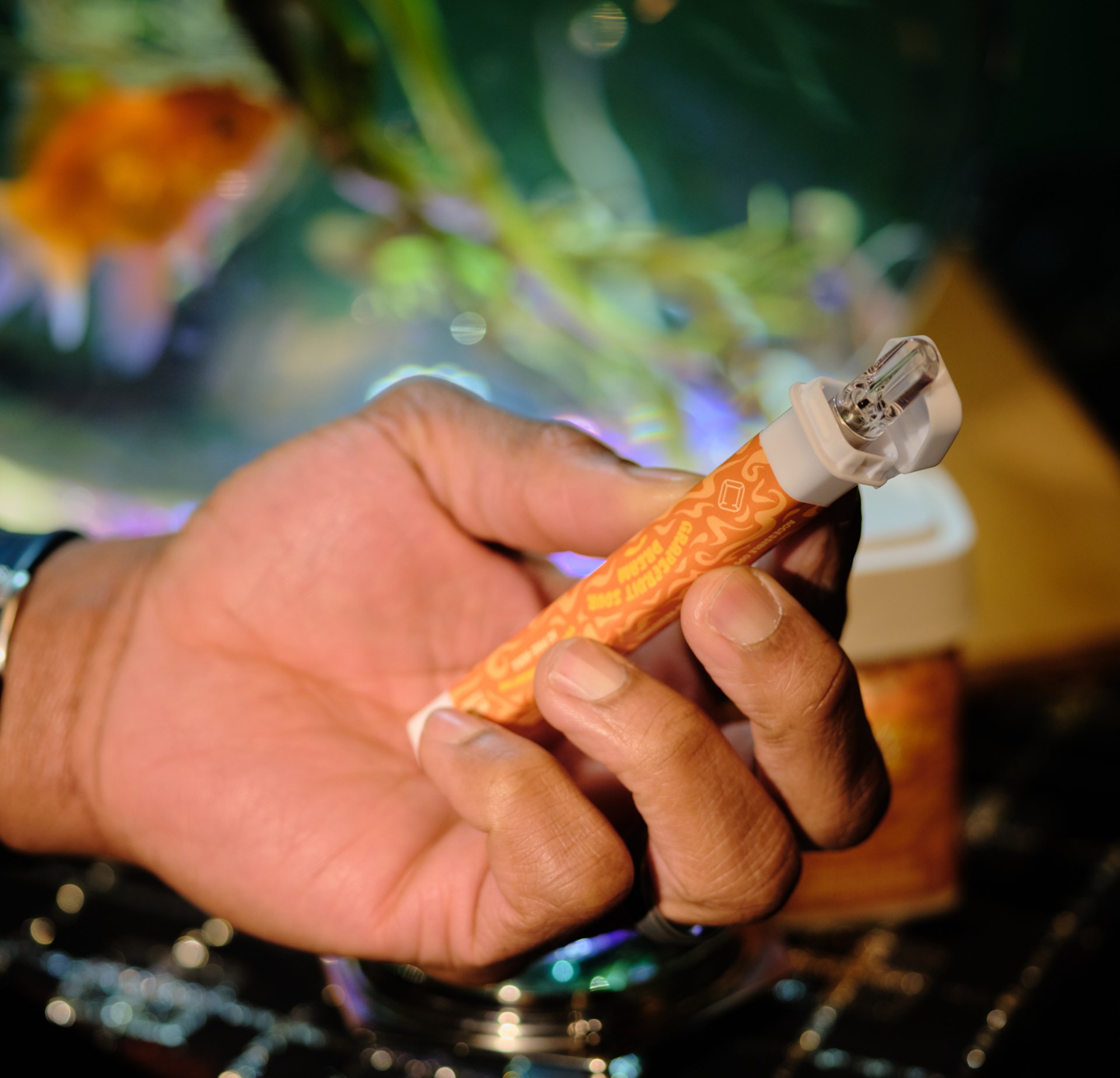 Cannabis vape and cartridge in a Calyx pre-roll tube with custom branding